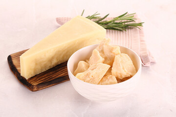 Chopped Italian hard parmesan cheese