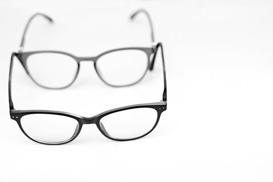 glasses on display on a table at an optician shop no people on white background stock image stock photo