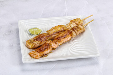 Grilled salmon skewer with sauce