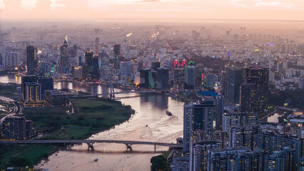 Aerial view of Ho Chi Minh City skyline and skyscrapers on Saigon river, center of heart business at downtown, cityscape in the night