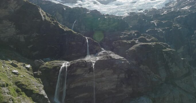 Aerial Ascend Shot Of Waterfall During Sunny Day, Drone Flying Over Mountains - Otago, New Zealand