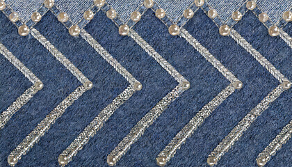 blue denim background with stitches and silver sequin zig zag stripes