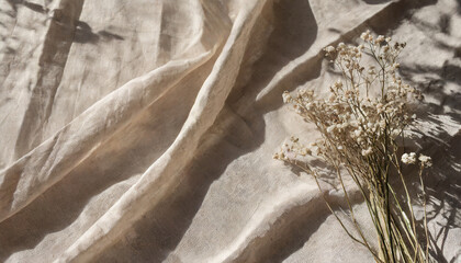 crumpled linen fabric texture with folds in sun light and lifestyle floral sunlight shadow aesthetic minimal bohemian neutral beige background