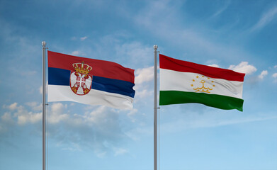 Tajikistan and Serbia flags, country relationship concept