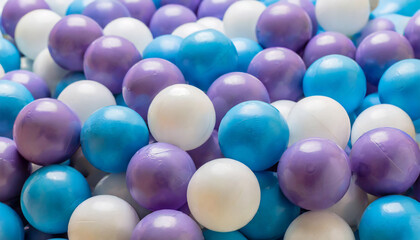 heap of colorful plastic balls in white blue and purple colors