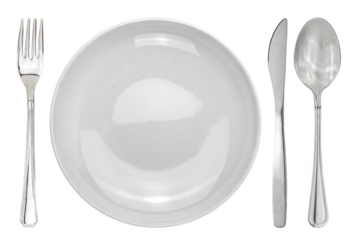Table setting with a white plate next to cutleries. Plate with fork and knife and spoon isolated