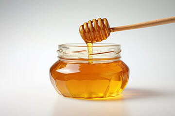 Glass jar full of honey and dipper on white background. Generative AI