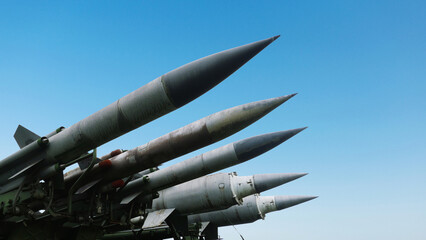 Missiles weapons rockets on a blue sky, concept. War in Israel and Palestine. Armed conflict. Terrorists - obrazy, fototapety, plakaty