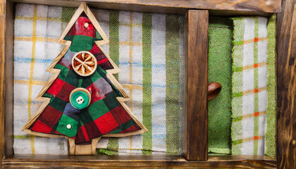 wooden christmas tree with textile plaid tree inside and button