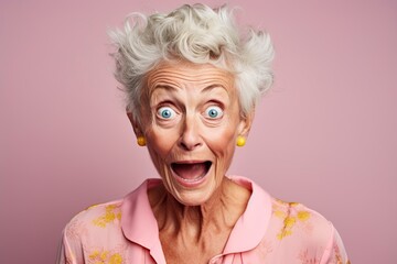 old woman squinting and grimacing in front of the camera in the studio - obrazy, fototapety, plakaty
