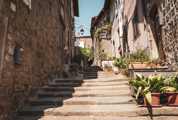 narrow street with stairs in the medieval old town of Viterbo, Lazio, Italy