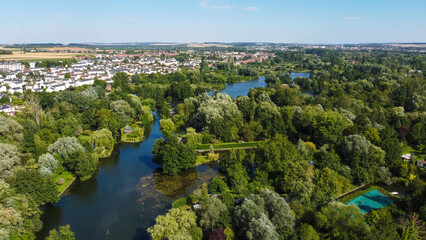 Fototapeta premium Aerial view of the Hortillonnages of Amiens made of several islands covered with gardens sheds and plantations in a swampy area of the river Somme in Picardie, France