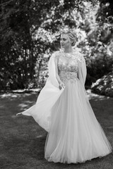Fototapeta premium portrait of a happy bride in a light light dress in wearing elven accessories