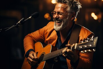 Obraz premium The musician plays an acoustic guitar emotionally, and sings the song.