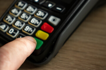  Closeup shot of a payment terminal keyboard, representing a banking concept.