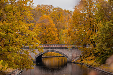 Canal bridge in autumn colors in Riga, Latvia during beautiful autumn time