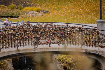 Hundreds of locks locked on the side of the bridge railing in Riga, Latvia. Symbol of love and...