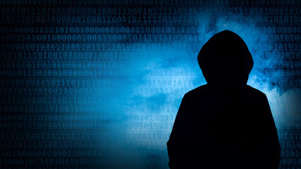 Silhouette of a cybercriminal against a backdrop of swirling blue smoke and numbers, cybercriminal...