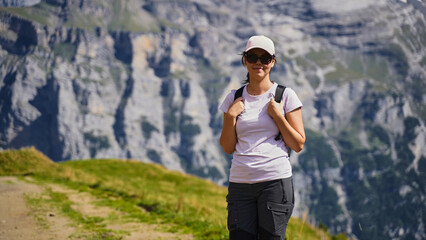 Fototapeta premium Woman hiking in the Swiss Alps