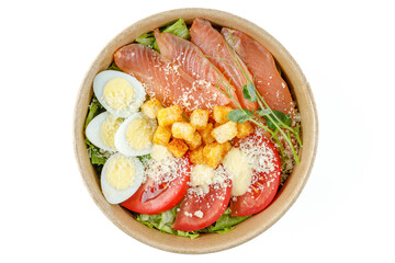 Caesar salad with salmon on a white background for a food delivery site 1