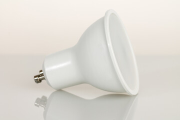 LED light bulb GU10 base, energy-saving energy conservation, isolated on light background