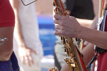 hands on the saxophone close-up