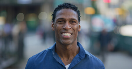 Black man smiling happy face portrait on city street