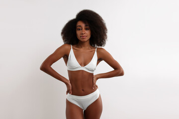 Fototapeta premium Beautiful woman in stylish bikini on white background