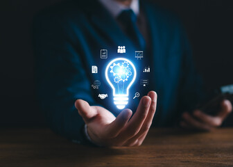 Business solution idea concept. Businessman  creative light bulbs with marketing network, planning...