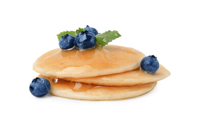 Tasty pancakes with blueberries and honey isolated on white