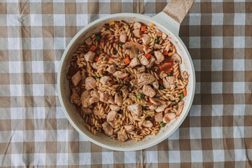 Homemade chicken breast pasta in a pan for high protein and diet recipe.