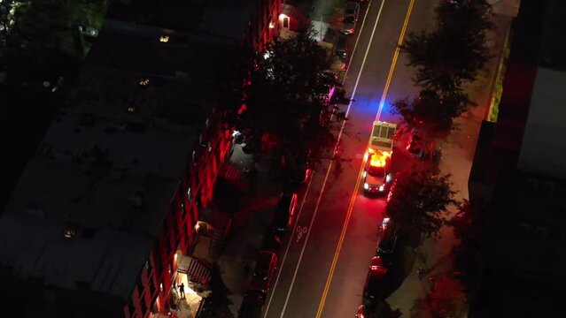 Aerial view of an ambulance on a Brooklyn street at night