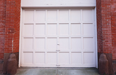 garage door stands tall, symbolizing security and convenience. A gateway to shelter cars and storage, it complements the home's aesthetic while ensuring protection