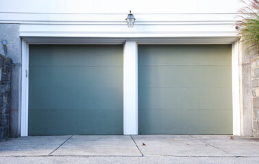 garage door stands tall, symbolizing security and convenience. A gateway to shelter cars and storage, it complements the home's aesthetic while ensuring protection