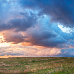 Panoramic background of evening sky with dramatic stormy clouds