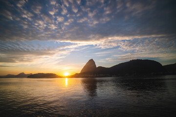 Morning sunrise silhouette of Sugarloaf Mountain Pao de Acucar and Guanabara Bay in Rio de Janeiro, Brazil