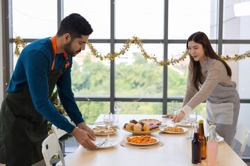 Asian Couple Creates Culinary Magic: Preparing a Festive Christmas Dinner Together