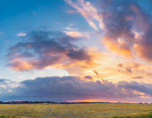 Fototapeta premium Beautiful panoramic sky with glowing clouds at sunset