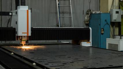 CNC machine. Laser cutting of metal. Sparks.