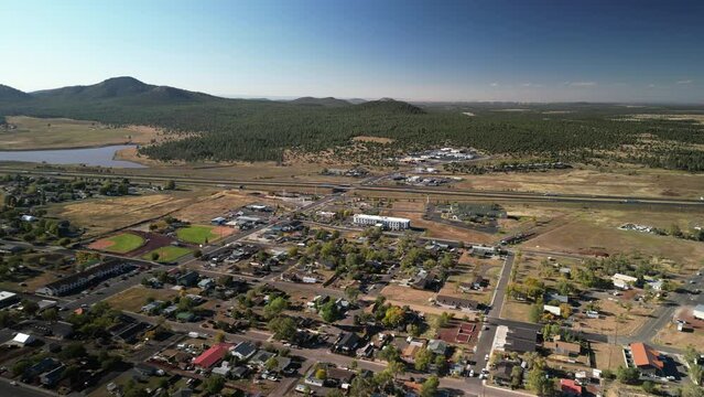 Aerial above small tourist town of Williams Arizona in fall