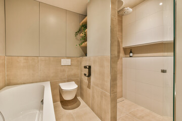 a bathroom with a toilet, sink and bathtub in the middle of the room there is a mirror on the wall