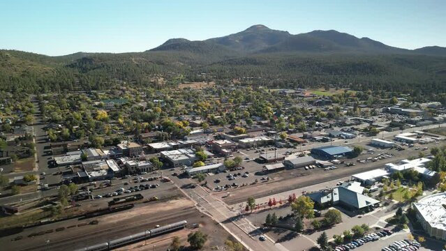 Aerial above tourist town of Williams Arizona in fall with shops hotels restaurants and main street