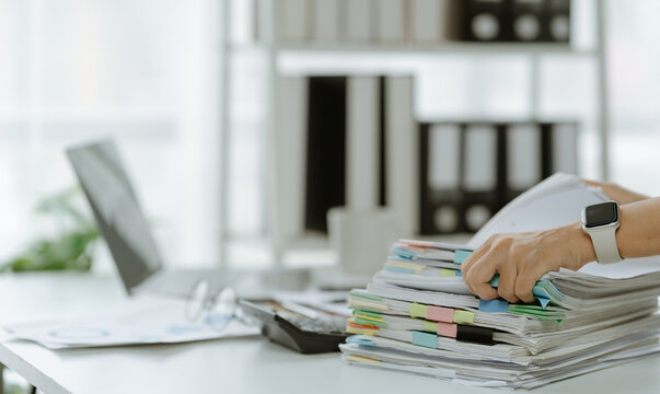 business documents businessman check legal document review Prepare documents or analysis reports, tax items, accounting documents, data contracts, office partner agreements.
