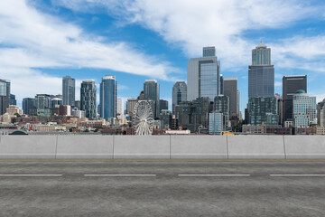 Empty urban asphalt road exterior with city buildings background. New modern highway concrete construction. Concept way to success. Transportation logistic industry fast delivery. Seattle. USA.