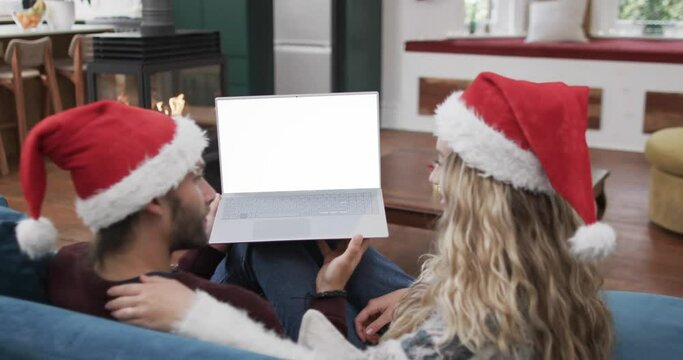 Happy Caucasian Couple Having Christmas Laptop Video Call With Copy Space, Slow Motion