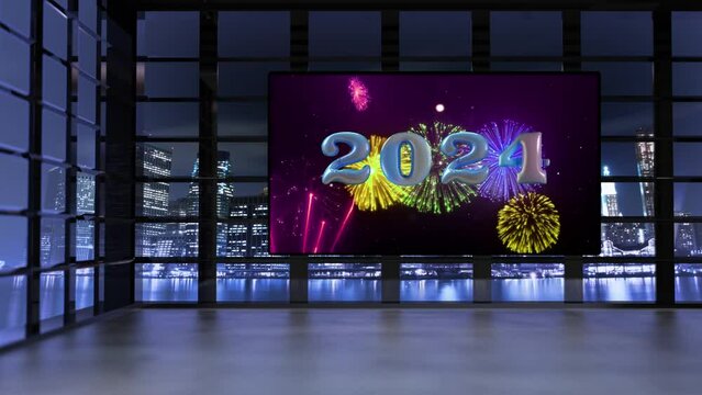 A&ntilde;o Nuevo. Interior de edificio mostrando pantalla gigante con fuegos artificiales y 2024 globos latiendo. A trav&eacute;s de las ventanas se ve la ciudad iluminada por la noche con reflectores movi&eacute;ndose.
