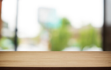 Mock up for space. Empty dark wooden table in front of abstract blurred bokeh background of restaurant . can be used for display or montage your product