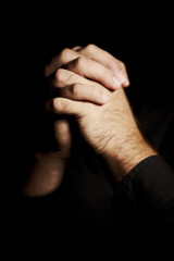 Praying, hands and black background for faith, hope and religion or asking for help with mental...