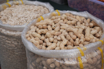 top view of Several peanuts in a basket.