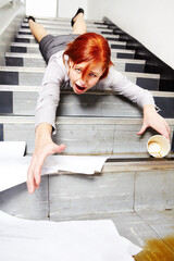 Woman, falling down and stairs for injury, accident and wow with coffee, documents or paperwork in building. Business, person or employee slipping on steps at work or office with paper, cup and shock © Mariusz S/peopleimages.com